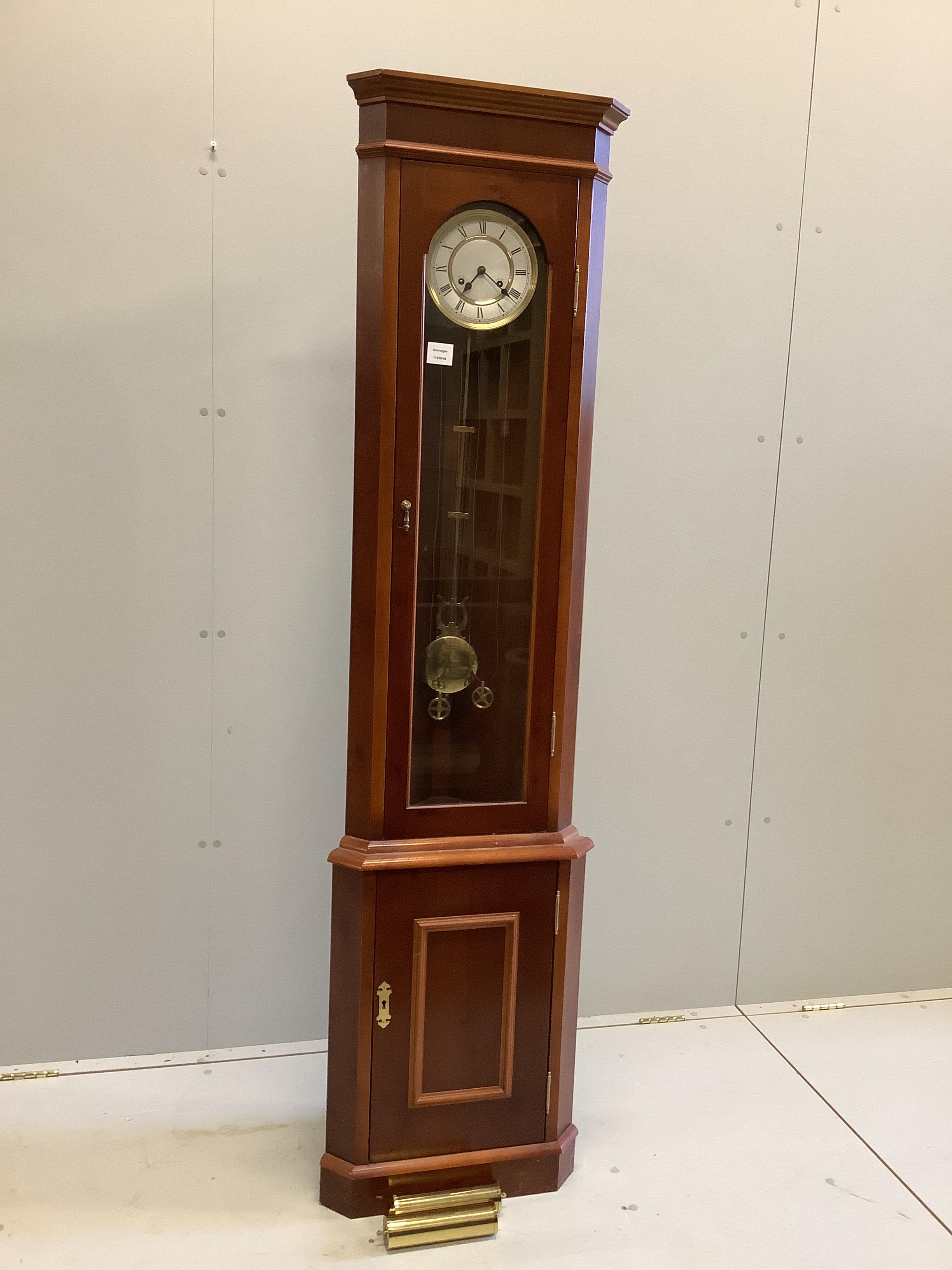 A Vienna regulator clock movement in a later associated corner cupboard, width 46cm, height 181cm